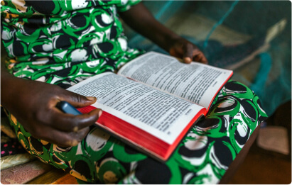 Woman with the Bible opened on her lap