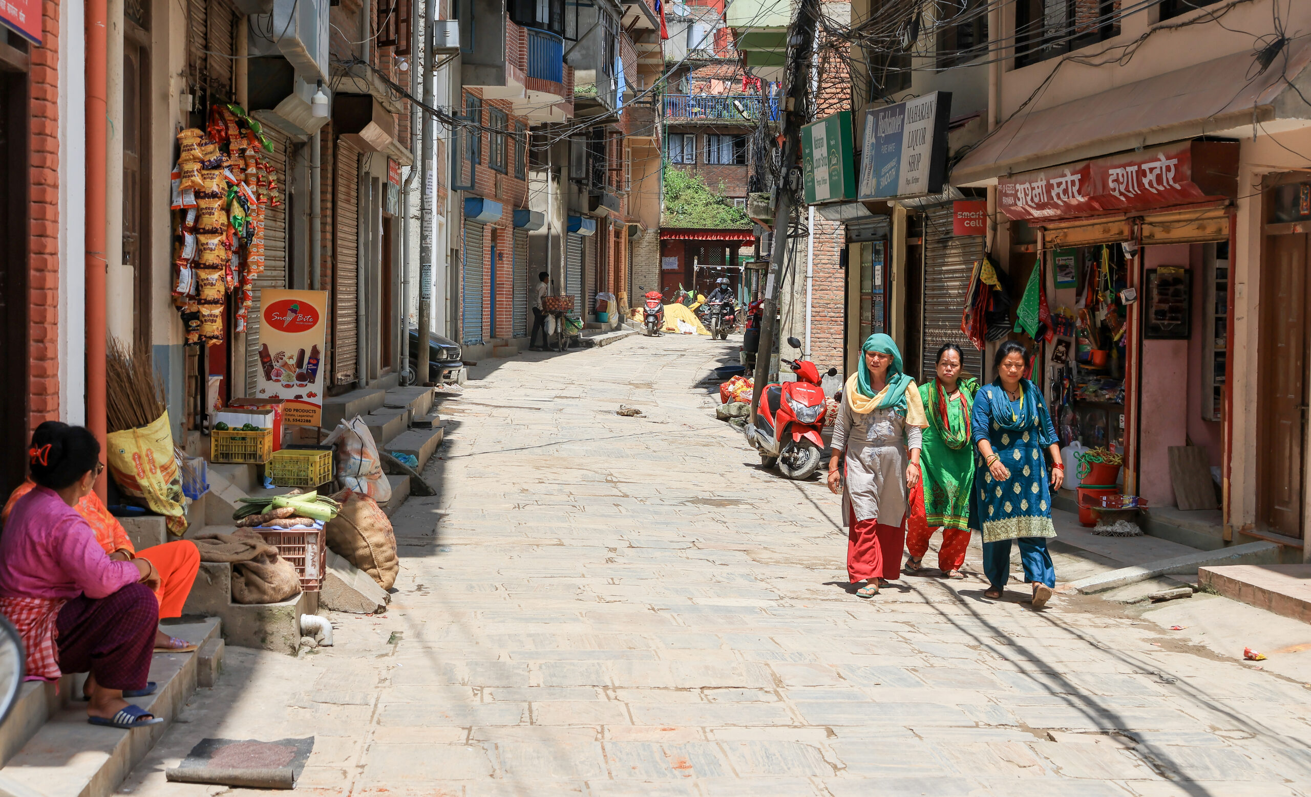 Women walking on street in Nepal